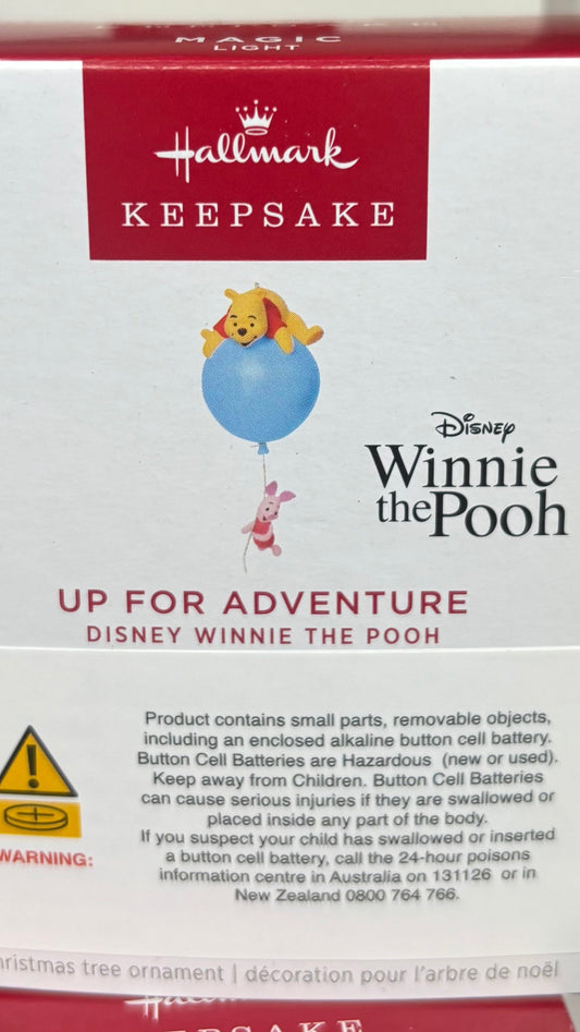 Hallmark Keepsake ornament packaging featuring Winnie the Pooh with a red and white box.