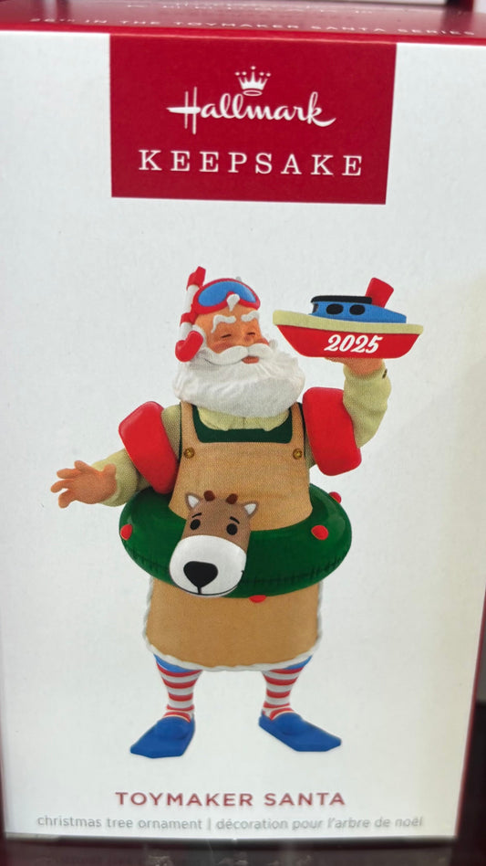 Hallmark Keepsake ornament packaging featuring a Toy Maker Santa figure on a shelf.