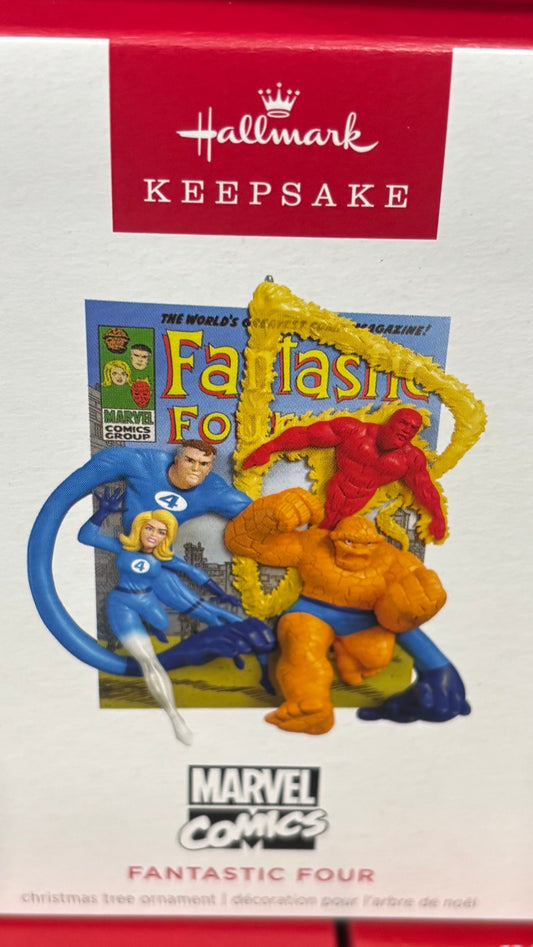 Hallmark Keepsake ornament packaging with Marvel Fantastic Four figure on a shelf.